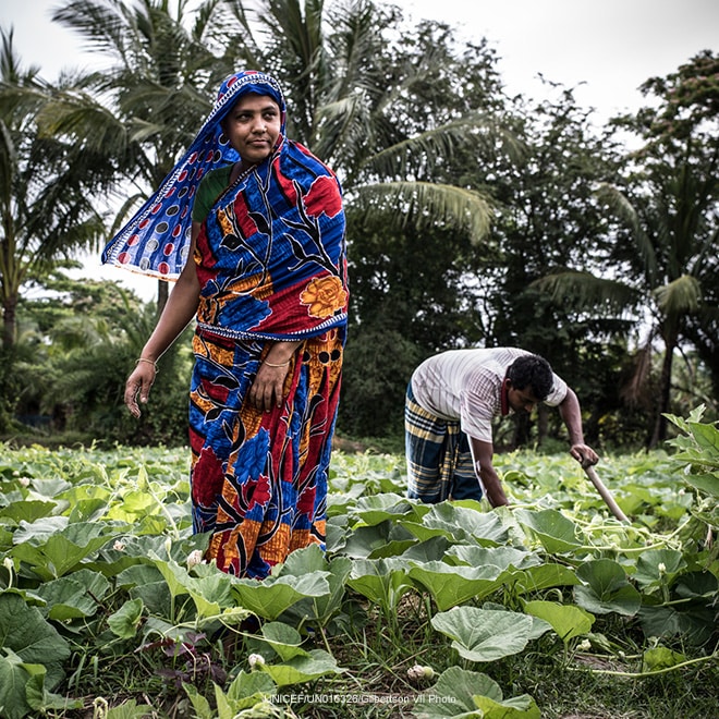 A couple tend their garden, Bangladesh
